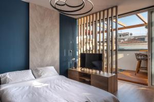 Ein Bett oder Betten in einem Zimmer der Unterkunft Ethereal Athεns