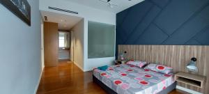 a bedroom with a large bed with a blue ceiling at Anggun Presidential Suites in Kuala Lumpur +75 photos