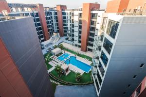 an aerial view of a building with a swimming pool at Boudl Al Jubail in Al Jubail