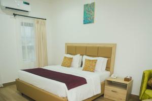 Postel nebo postele na pokoji v ubytování Quest Boutique Hotel