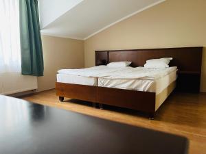 Postel nebo postele na pokoji v ubytování Derby Apart KVary