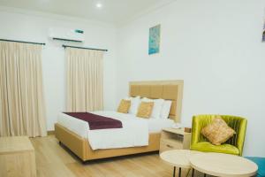 Postel nebo postele na pokoji v ubytování Quest Boutique Hotel