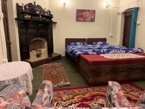 En eller flere senger på et rom på Rose Villa Heritage Bungalow No 9