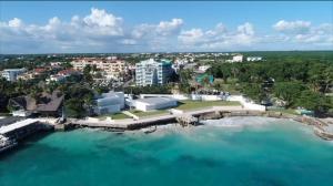 an aerial view of a resort and the water at Vista Marina Residence in Boca Chica