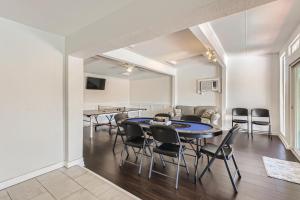 a dining room with a table and chairs at New 5 BDRM W/Pool Mins to Pearl/Riverwalk/Quarry Market - Sleep 12 in San Antonio