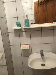 a bathroom with a sink and a mirror at Marija in Zlatibor