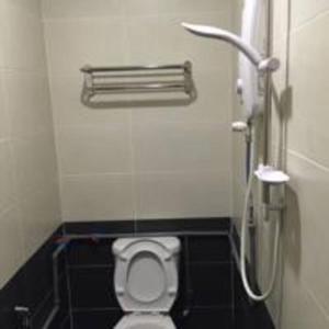 a bathroom with a toilet in a stall at JSK lovely home in Kuala Terengganu