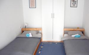 Giường trong phòng chung tại Apatin apartman