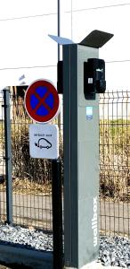 a machine with a sign on it next to a fence at ATOLON PARK HOTEL in Brumath