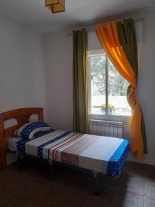 Postel nebo postele na pokoji v ubytování Casa Rural Pantano de San Juan
