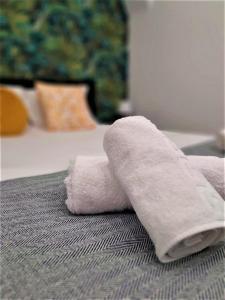 a towel sitting on top of a bed at NatureHouse in Campo Maior