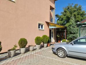 a car parked in front of a building at Holiday in Ferizaj