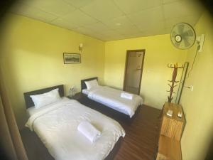 Letto o letti in una camera di Ocean Inn