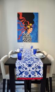 a dining room table with a blue and white table cloth at Apartman Favorita in Vienna