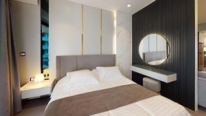 Ένα ή περισσότερα κρεβάτια σε δωμάτιο στο Al Fares Luxury furnished Apartment-Damac Tower +39 φωτογραφίες