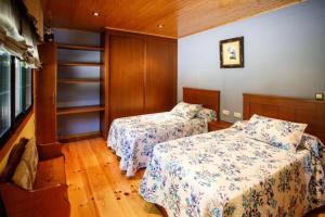 En eller flere senge i et værelse på Villacambote5