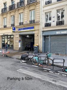 a group of bikes parked in front of a building at Paris Marais Arev in Paris