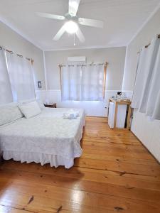 Ένα ή περισσότερα κρεβάτια σε δωμάτιο στο The Odyssey Resort Utila