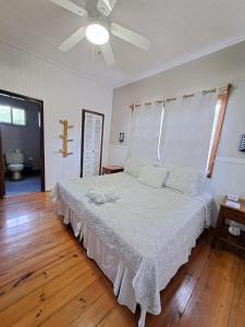 Ένα ή περισσότερα κρεβάτια σε δωμάτιο στο The Odyssey Resort Utila