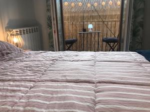 Un ou plusieurs lits dans un hébergement de l'établissement Apartamento centro Santander B