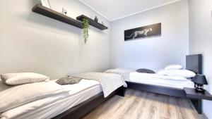 Posteľ alebo postele v izbe v ubytovaní Diamond Luxury Apartment