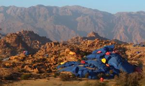 a group of tents on a mountain with mountains at Azur Tafraout in Tafraoute