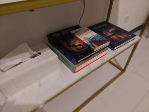 two books sitting on top of a shelf at RYE Ferienwohnung Hamburg in Hamburg +21 photos