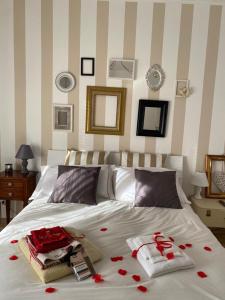 a bedroom with a bed with red roses on it at LìRìcordi in Isola del Liri