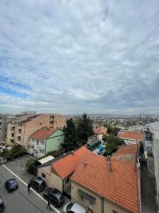 an overhead view of a city with buildings and cars at Naomi in Voždivac