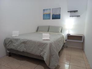 Ένα ή περισσότερα κρεβάτια σε δωμάτιο στο W's Hostel