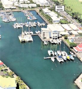 an aerial view of a marina with boats in the water at Marina MANZANA, Appartement neuf, vue mer exceptionnelle - LUXE in Saint-François