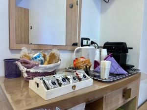 a kitchen counter with a table with some food on it at Le Essenze - Agriturismo con vista in Cesena