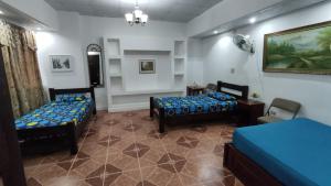 Postelja oz. postelje v sobi nastanitve BlueRock Hostal