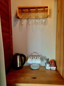 a kitchen counter with a tea kettle and a tea pot at Pousada Morada dos Sonhos in Urubici