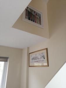 a living room with a book shelf on the ceiling at London's Calling U! A Lovely 2 BedHome Sleeps 1-5! in London