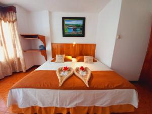 Voodi või voodid majutusasutuse Hotel Sula Sula toas