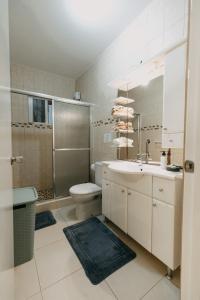a bathroom with a sink and a toilet and a shower at Bubali Studio in Palm-Eagle Beach
