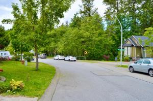a street with cars parked on the side of the road at jane's cozy suite in Surrey