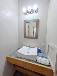 Ένα ή περισσότερα κρεβάτια σε δωμάτιο στο The Odyssey Resort Utila