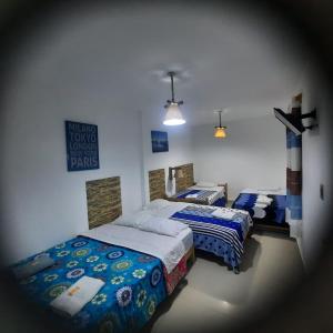 Tempat tidur dalam kamar di Hostal Brisa Marina