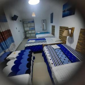 En eller flere senge i et værelse på Hostal Brisa Marina
