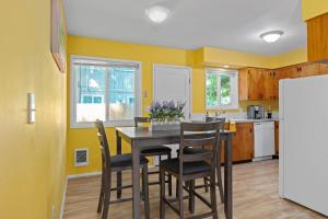 a kitchen with a dining room table and chairs at A place to CHILL! in Portland