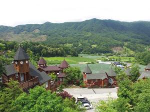 an aerial view of a town with mountains in the background at Korea Quality Elf Hotel in Pyeongchang