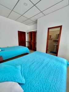 Voodi või voodid majutusasutuse Hostal Punta Arena toas