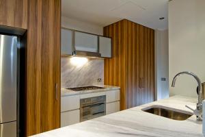 a kitchen with a sink and a counter top at Glebe Park Canberra City ACT in Canberra