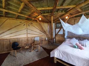 Postel nebo postele na pokoji v ubytování Ecohotel Soplo del Tambo + 37 fotografií