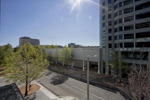 a view of a city with a building and trees at Manhattan 303 Canberra City ACT in Canberra