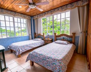 Cama o camas de una habitación en Chalet Villa Puebla