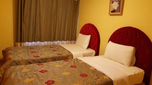Elf Resort Hotel客房内的一张或多张床位