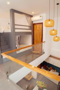 a staircase in a house with a glass floor at Mai Hotel in Vung Tau